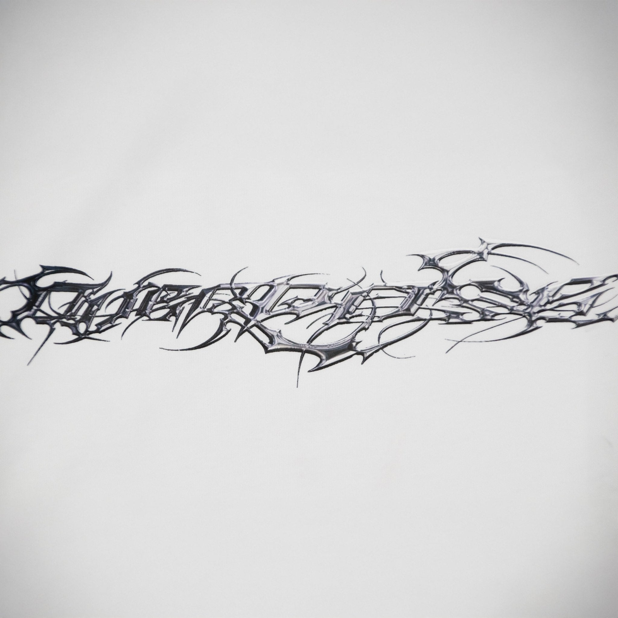 "TRIBAMETAL" LOGO TRNSFRMR L/S - ANGEL